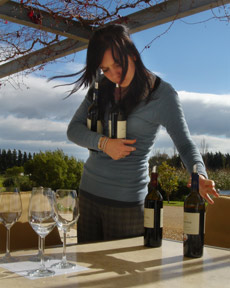 girl holding wine bottles